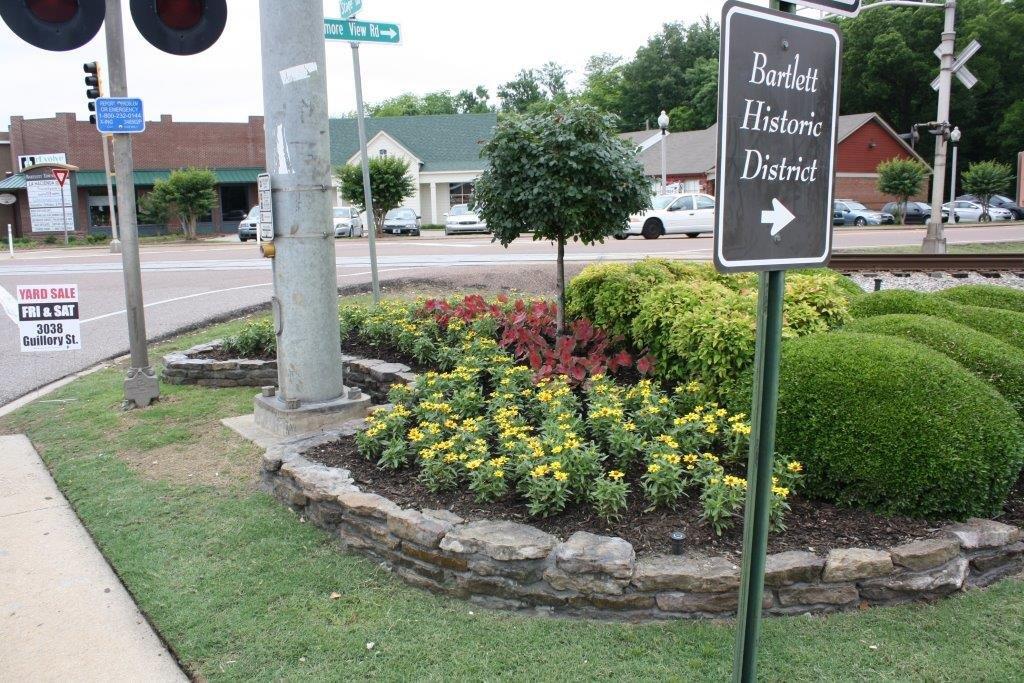 Flower bed by the Bartlett Historic District Sign